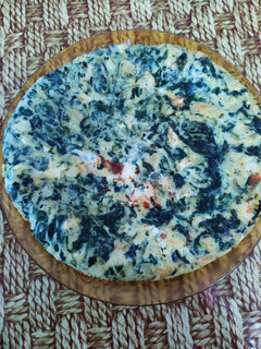 Una foto de Tortilla de patata con espinacas y queso