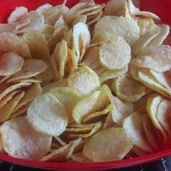A picture of Home made potato crisps.