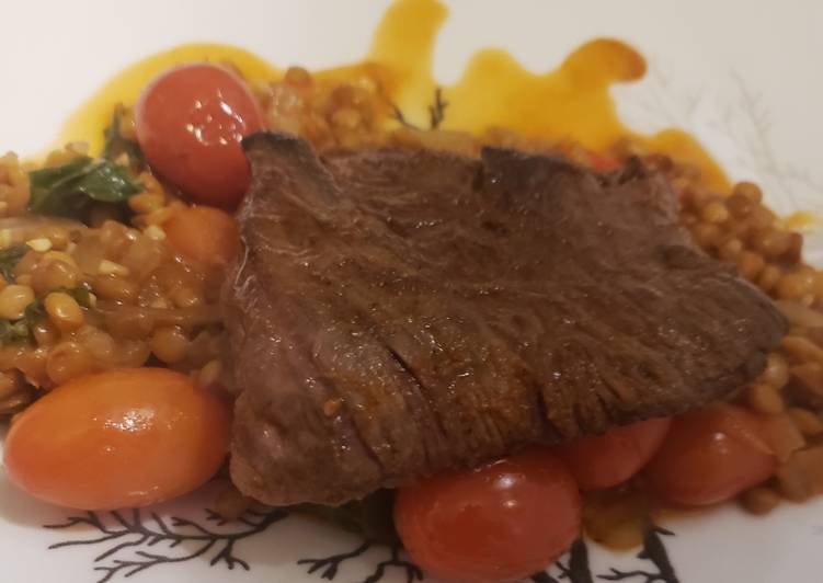 Step-by-Step Guide to Prepare Award-winning Seared skirt steak over spiced lentils