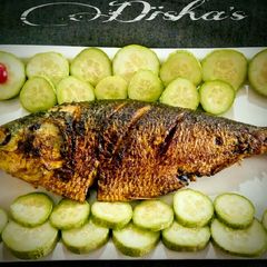 A picture of Stuffed and roasted Hilsa.