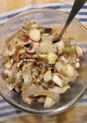 A picture of Endive salad with mushrooms and walnuts.