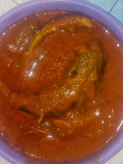 A picture of Smoked mackerel curry stew with scent leaf.