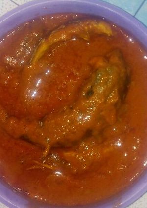 A picture of Smoked mackerel curry stew with scent leaf.