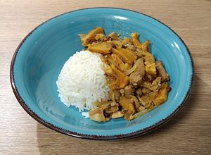 Foto principal de Wok de lomo de cerdo con piña en salsa de cítricos al achiote