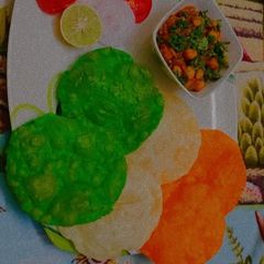 A picture of Tricolor chole Bhature.