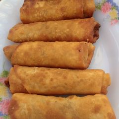 A picture of Spring rolls with leftover mixed vegetables.