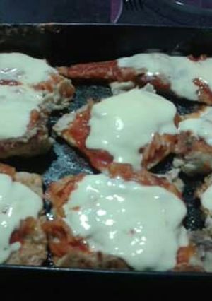 Una foto de Filete de Merluza a la Pizza