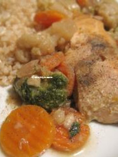 A picture of Salmon filet stew with carrots, brocoli and cauliflower.