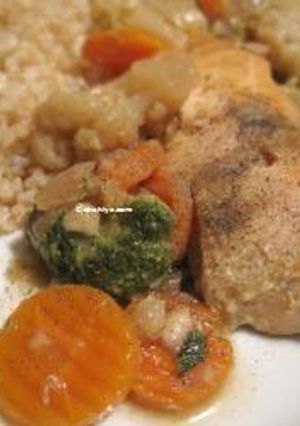 A picture of Salmon filet stew with carrots, brocoli and cauliflower.