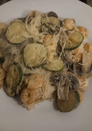 A picture of Vermicelli rice noodles with mushrooms, courgettes and prawns.