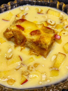 A picture of Eggless Bread pudding with vanilla custard sauce.