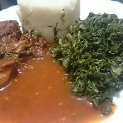 A picture of Ugali fried chicken spinach and "Dosaki sauce".