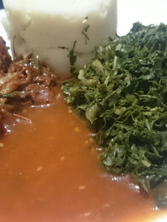A picture of Ugali fried chicken spinach and "Dosaki sauce".