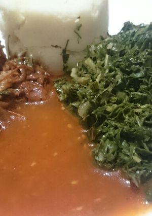 A picture of Ugali fried chicken spinach and "Dosaki sauce".