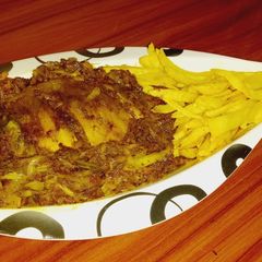 A picture of Grilled fish with fried Irish.
