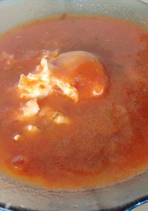 A picture of Huevos Ahogados (Eggs Poached in Tomato Sauce).