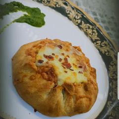 Open samosa with cheese filling A picture of Open samosa with cheese filling.