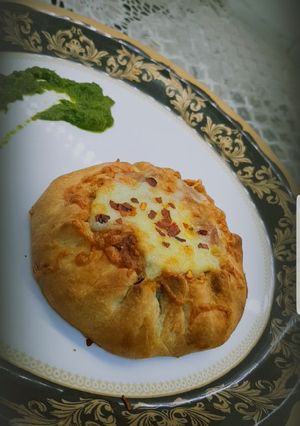 A picture of Open samosa with cheese filling.