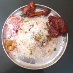 A picture of Chicken biriyani & chicken fry.