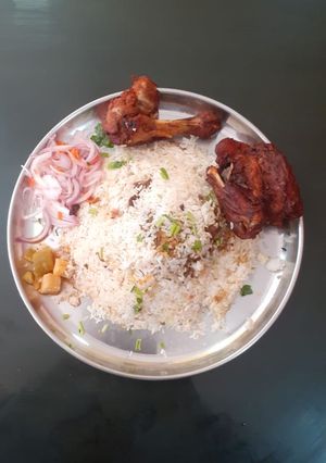 A picture of Chicken biriyani & chicken fry.