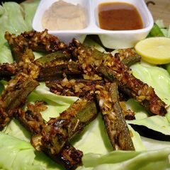 Baked ladyfinger/ baked bhindi A picture of Baked ladyfinger/ baked bhindi.