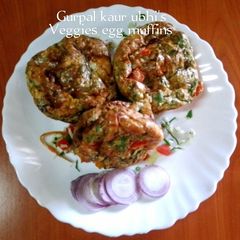 A picture of Veggies egg muffins 🥬🍅🥕🧅.