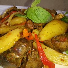 A picture of Spiced chips wit peppered gizzard 😋.