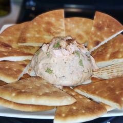 A picture of Smoked Salmon Dip with Homemade Pita Chips.