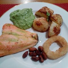 A picture of Baked salmon,pea purée, toasted almonds and Crisp roasted potato.