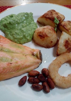 A picture of Baked salmon,pea purée, toasted almonds and Crisp roasted potato.