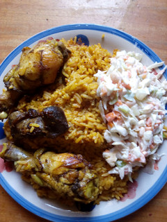 A picture of Jollof rice and salad.