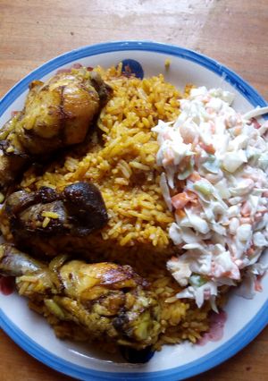 A picture of Jollof rice and salad.