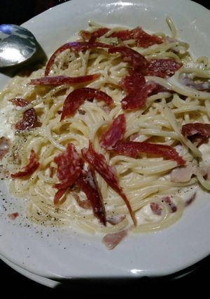 A picture of Carbonara with salami.