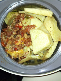 A picture of Yam and tomato/egg sauce.