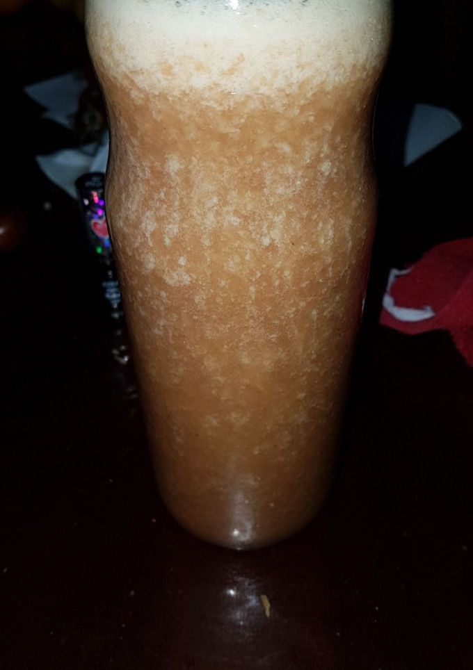 Una foto de Jugo de naranja y uva