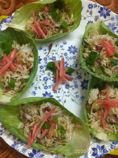 A picture of Leftover fried rice in cabbage cups.