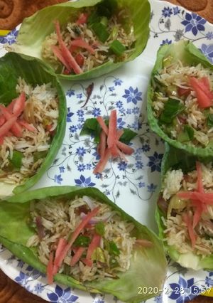A picture of Leftover fried rice in cabbage cups.