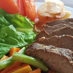 A picture of Slow Cooked Beef Steak With Potato Chips.