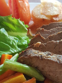 A picture of Slow Cooked Beef Steak With Potato Chips.