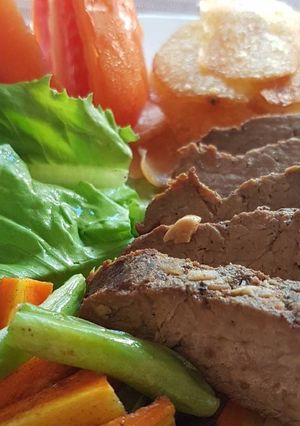 A picture of Slow Cooked Beef Steak With Potato Chips.