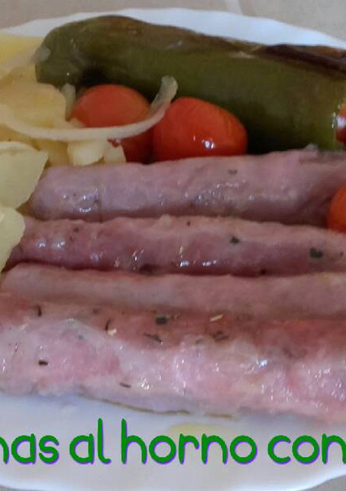 Una foto de Salchichas al horno con patatas*