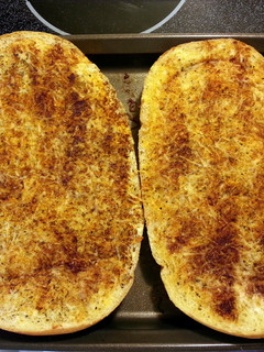 A picture of cheesy garlic bread.