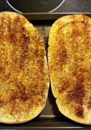 A picture of cheesy garlic bread.