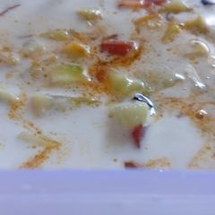 A picture of Tomato and Cucumber kichadi.