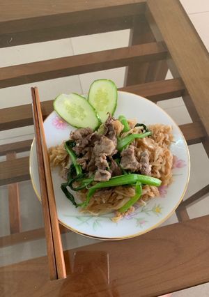 A picture of Stir-Fried Pho Noodles with Beef and Chinese Broccoli.