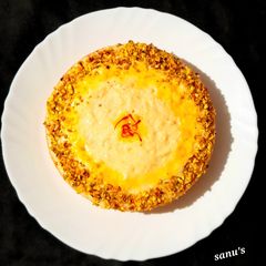 A picture of Eggless Saffron And Pistachio Rabdi Cake.