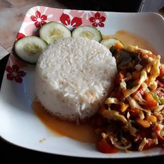 A picture of Rice and shredded chicken sauce.