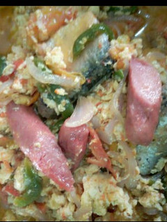 A picture of Fried eggs with sausages.