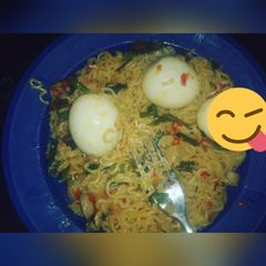 A picture of Noodles & boiled egg garnished with spring onions #Sokoto state.