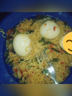 A picture of Noodles & boiled egg garnished with spring onions #Sokoto state.